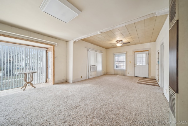 interior space featuring ceiling fan and carpet flooring