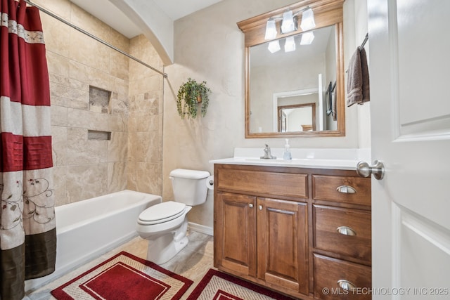 full bathroom with toilet, vanity, and shower / bath combo