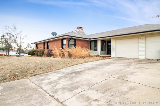 ranch-style home featuring a garage