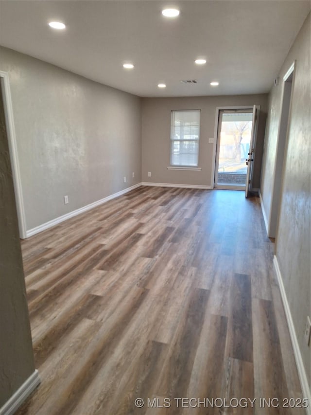 spare room with dark hardwood / wood-style flooring