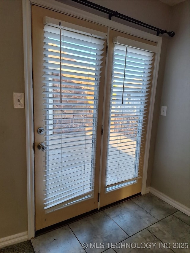 doorway featuring light tile patterned floors