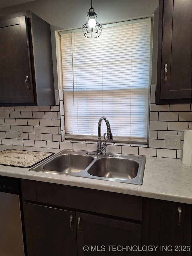 kitchen with dark brown cabinetry, sink, tasteful backsplash, dishwasher, and pendant lighting