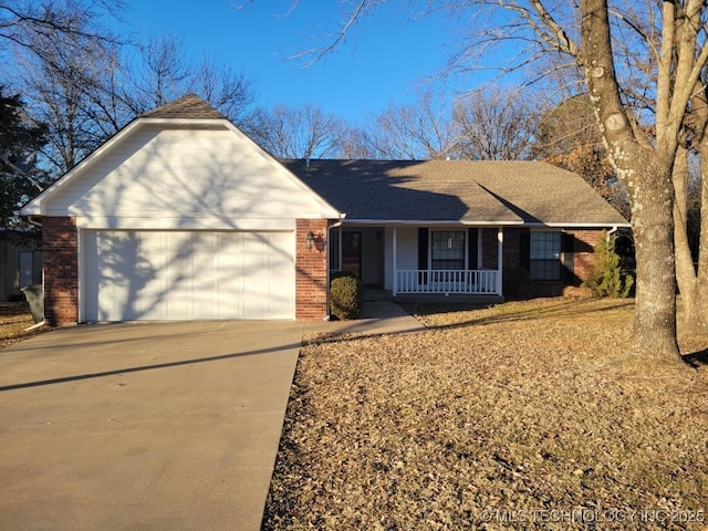 ranch-style house featuring a garage and a porch