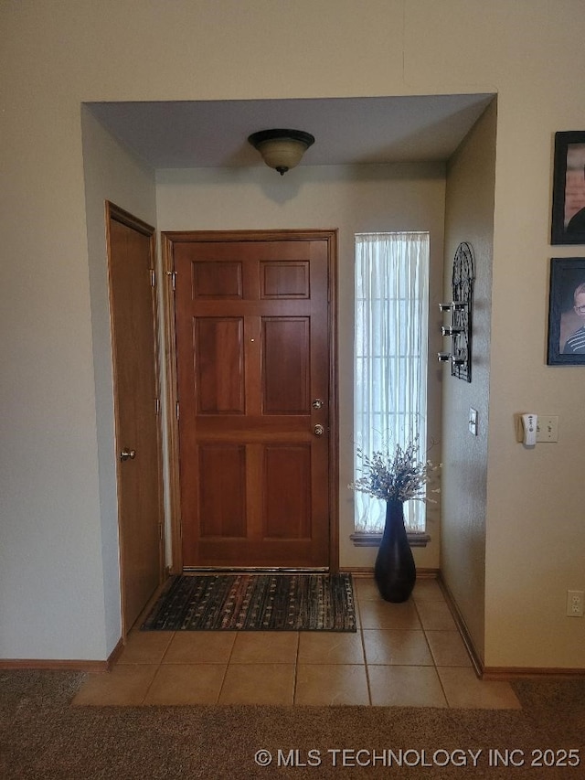 entrance foyer with tile patterned floors