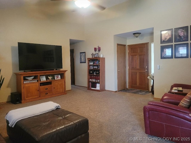 living room featuring ceiling fan and light colored carpet