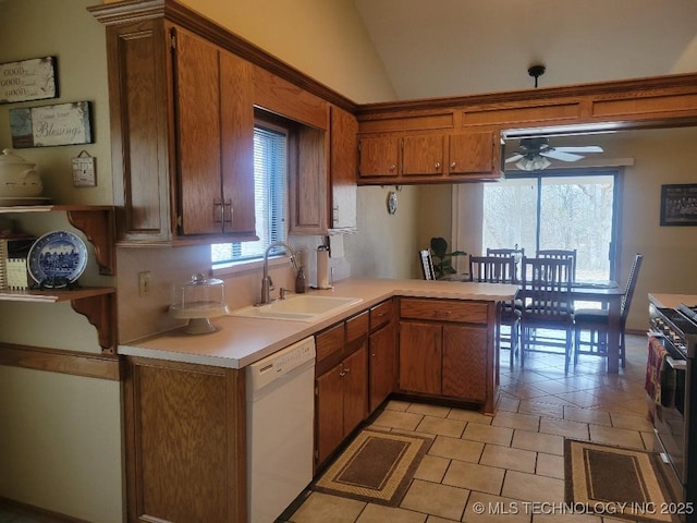 kitchen with sink, dishwasher, lofted ceiling, and a healthy amount of sunlight