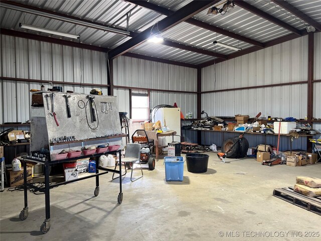5804 Samuel Rd, Kingston, OK 73439 - garage featuring metal wall and a workshop area