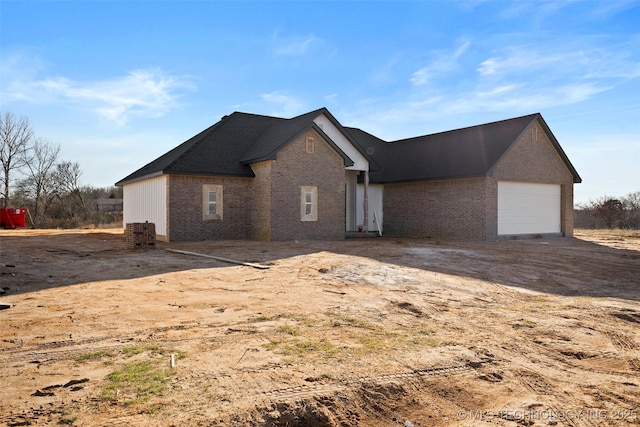 exterior space featuring brick siding