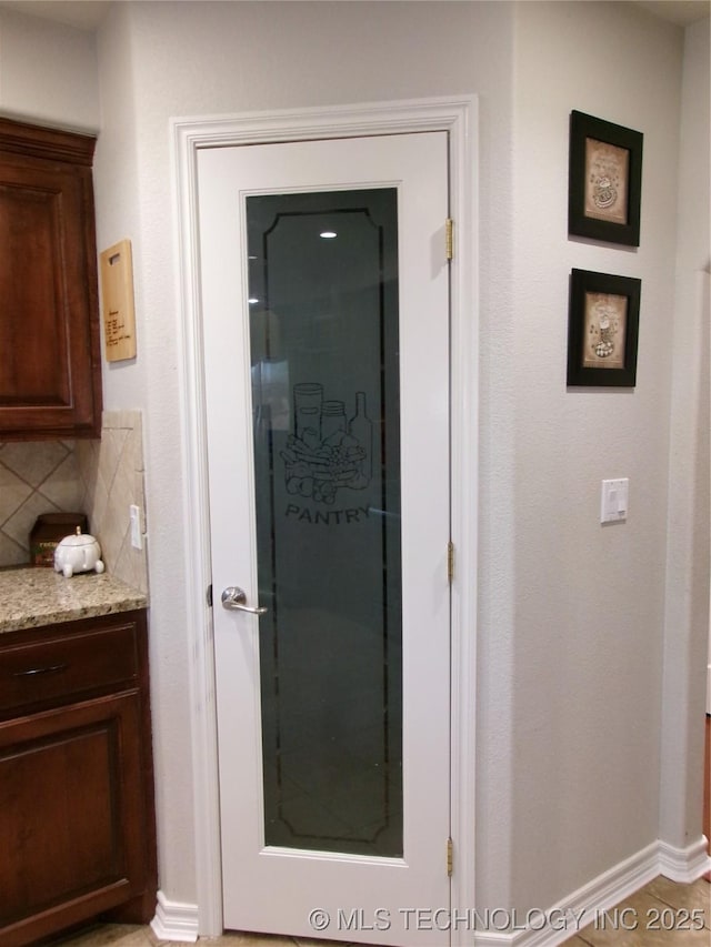 10500 W 123rd Rd, Oktaha, OK 74450 - interior space with tile patterned floors, vanity, and tasteful backsplash