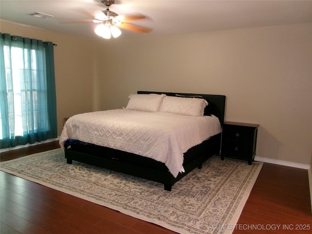 10500 W 123rd Rd, Oktaha, OK 74450 - bedroom with ceiling fan and dark wood-type flooring