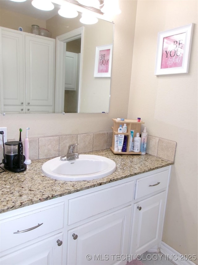 10500 W 123rd Rd, Oktaha, OK 74450 - bathroom with vanity and tasteful backsplash