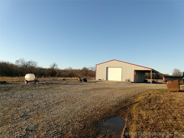 10500 W 123rd Rd, Oktaha, OK 74450 - view of outdoor structure featuring a rural view and a garage
