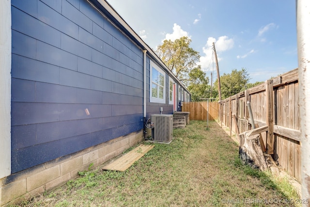 view of yard featuring central AC