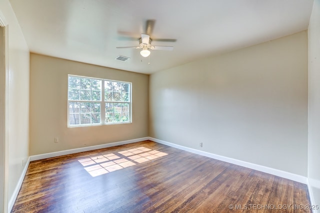 empty room featuring ceiling fan and wood-type flooring