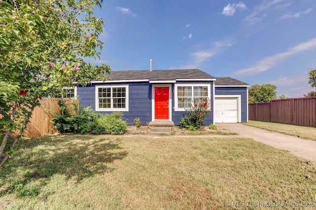 ranch-style home featuring a front lawn and a garage