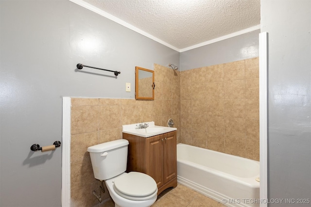 full bathroom featuring toilet, tile walls, tile patterned floors, a textured ceiling, and vanity