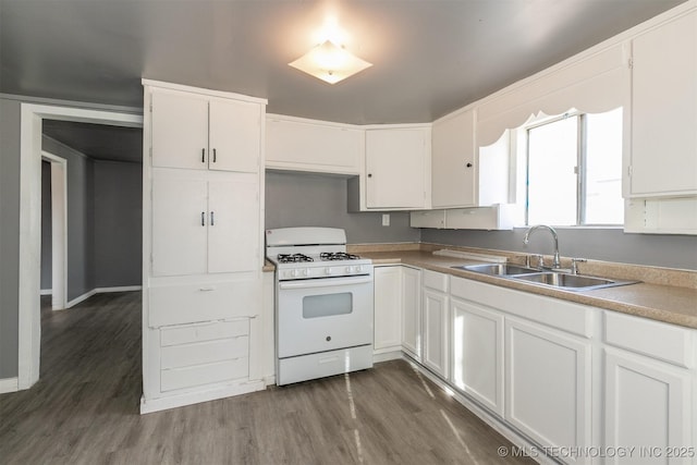 kitchen featuring dark hardwood / wood-style floors, white cabinetry, white range with gas stovetop, and sink