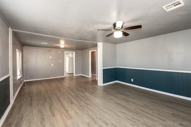 unfurnished room featuring ceiling fan and hardwood / wood-style flooring