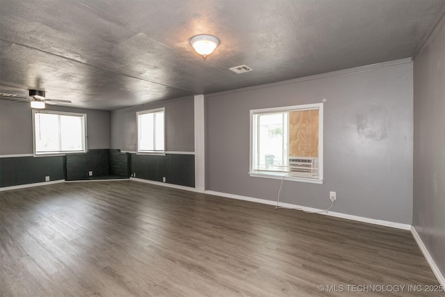 unfurnished room featuring ceiling fan and hardwood / wood-style floors