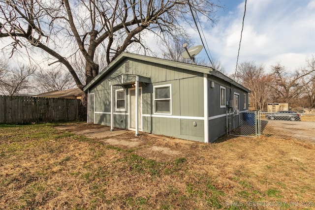 view of outbuilding with a lawn