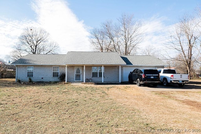 ranch-style house with a front yard and a garage