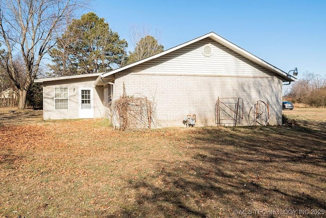 1799 W Main St, Westville, OK 74965 - view of side of home with brick siding and a yard