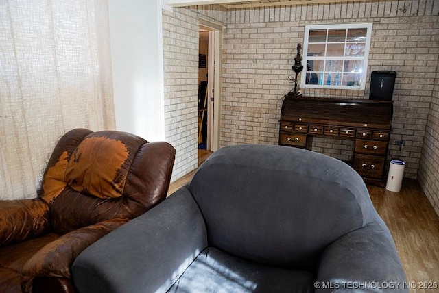 1799 W Main St, Westville, OK 74965 - living area featuring brick wall and wood finished floors