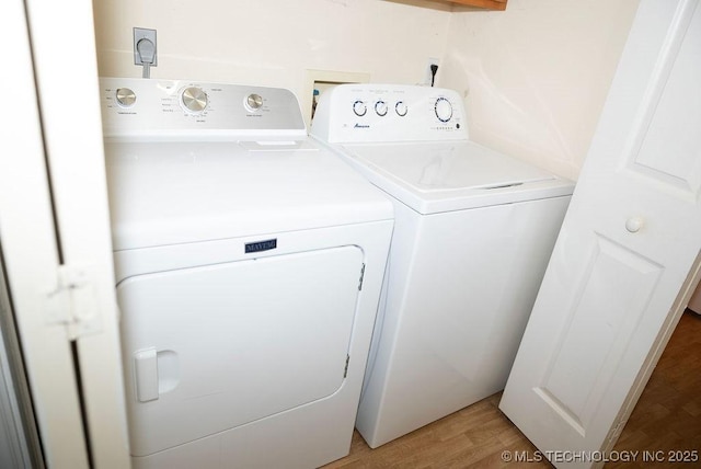 1799 W Main St, Westville, OK 74965 - laundry room featuring washing machine and clothes dryer and light wood-style flooring