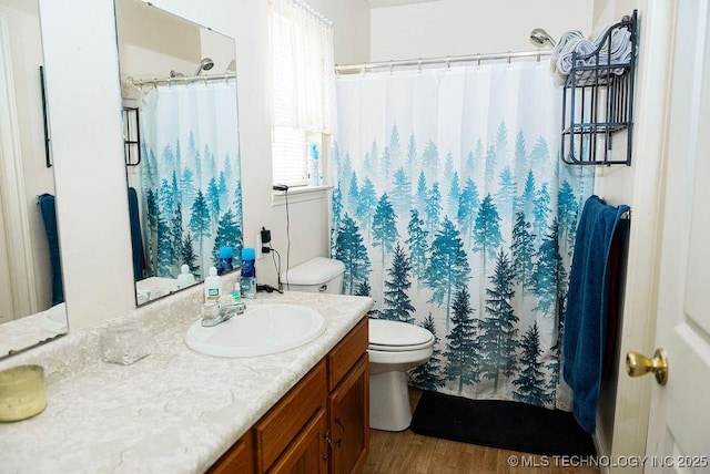 1799 W Main St, Westville, OK 74965 - full bathroom featuring vanity, toilet, wood finished floors, and curtained shower