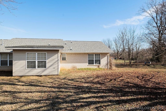 1799 W Main St, Westville, OK 74965 - rear view of house with brick siding and roof with shingles