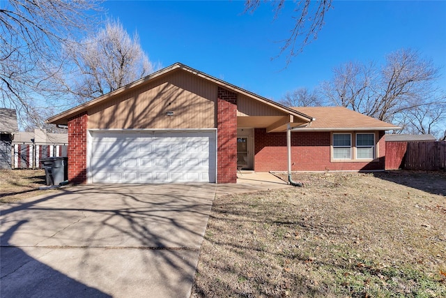 single story home with a front yard and a garage