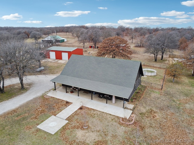 birds eye view of property featuring a rural view