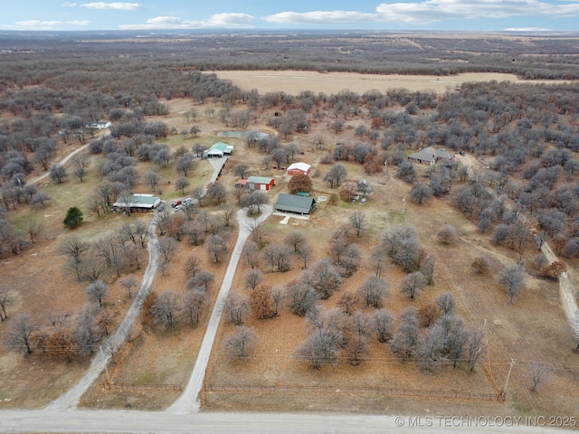 birds eye view of property with a rural view