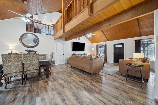 living room with high vaulted ceiling, beam ceiling, and wood ceiling