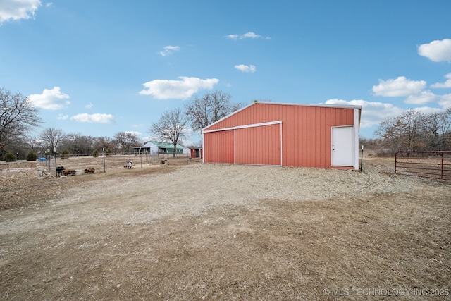 view of outbuilding featuring a rural view