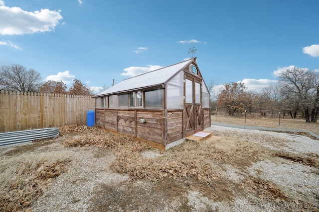 view of home's exterior featuring an outdoor structure