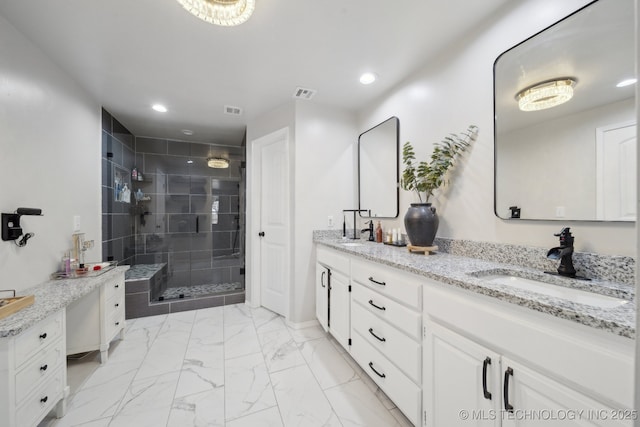 bathroom with walk in shower and vanity