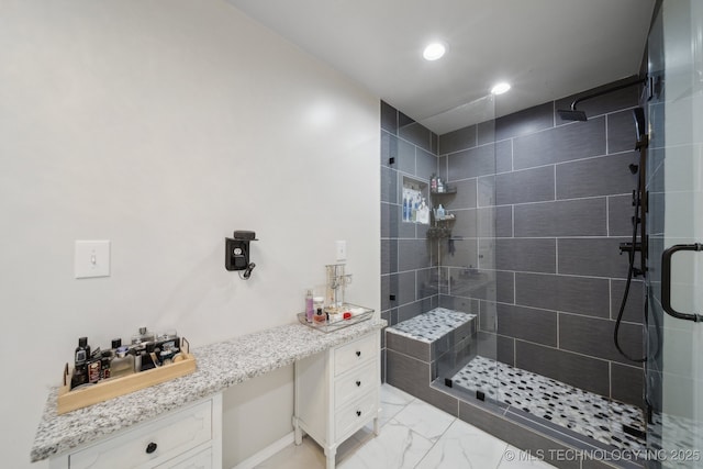 bathroom with vanity and an enclosed shower