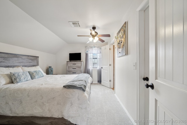 carpeted bedroom with ceiling fan and lofted ceiling