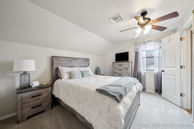 bedroom featuring ceiling fan, vaulted ceiling, and light carpet