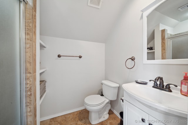 bathroom featuring walk in shower, vanity, vaulted ceiling, and toilet