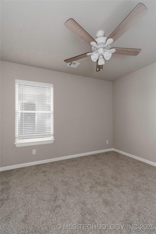 empty room featuring carpet floors and ceiling fan