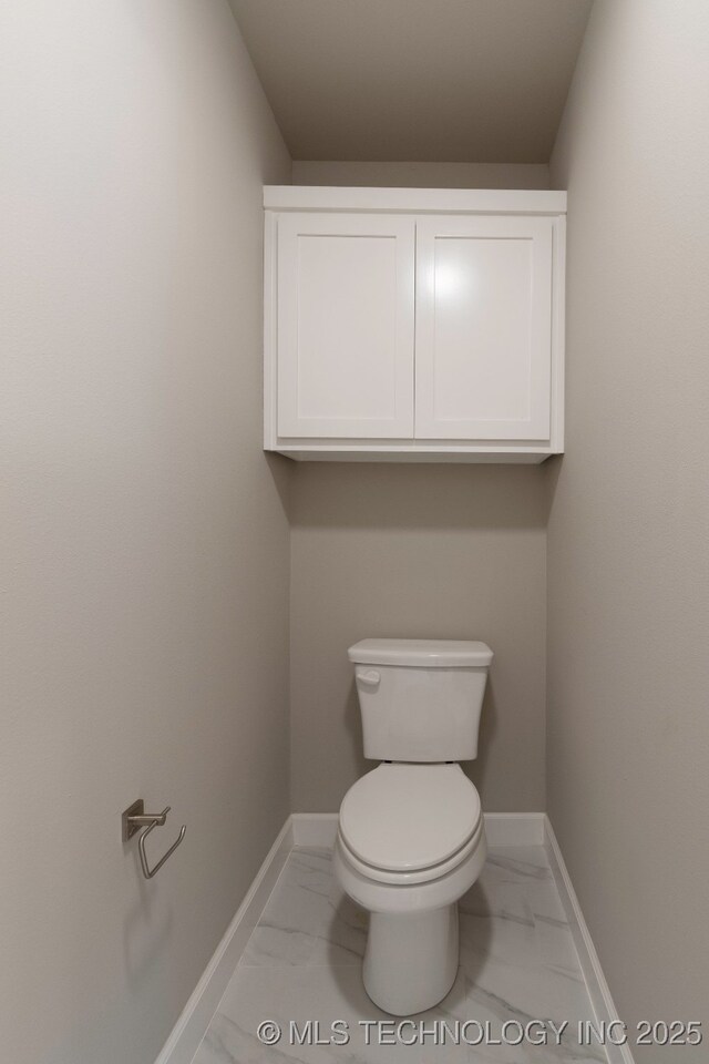 laundry room with cabinets, electric dryer hookup, hookup for a washing machine, and light hardwood / wood-style flooring