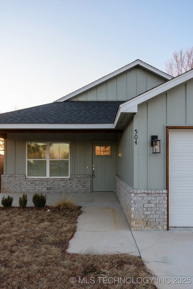 doorway to property featuring a garage