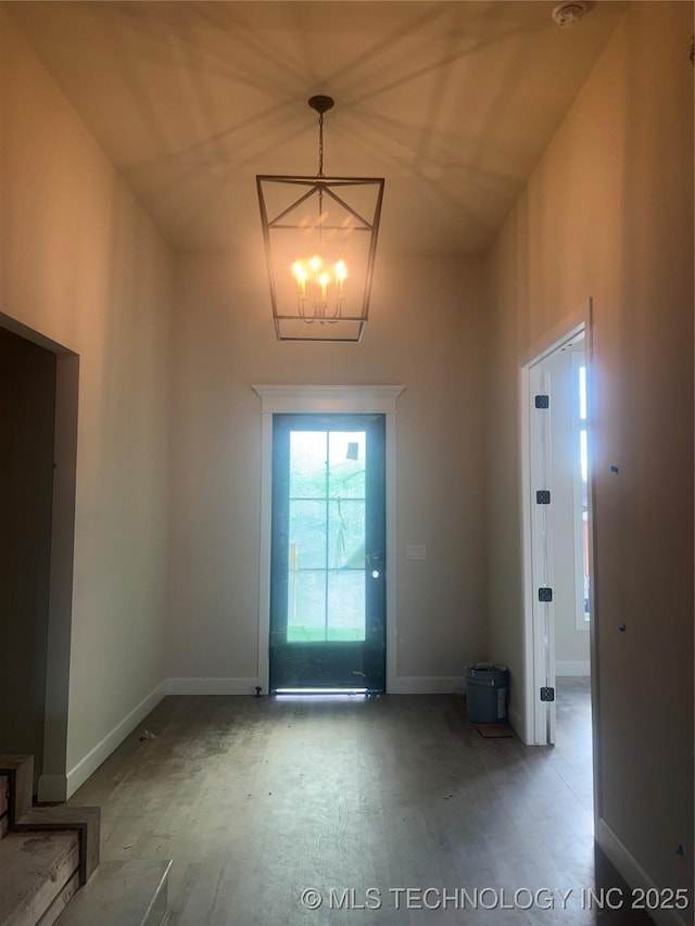 entryway featuring a notable chandelier