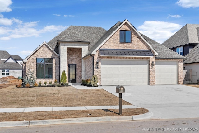 view of front of property with a shingled roof, concrete driveway, and brick siding