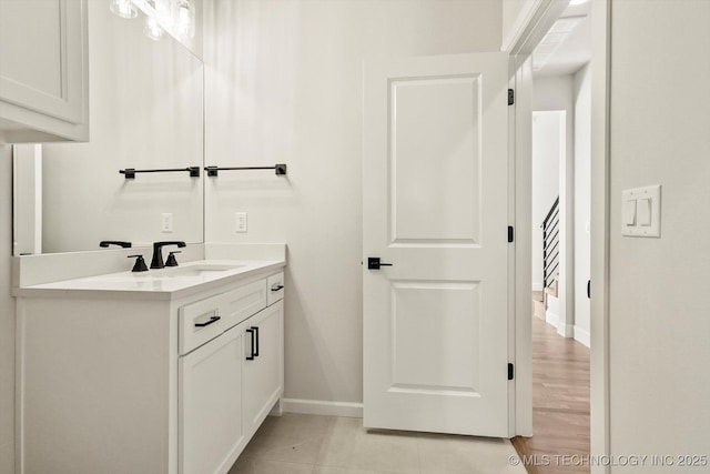 bathroom with vanity and baseboards