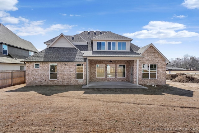 back of property featuring a ceiling fan, roof with shingles, fence, a patio area, and brick siding