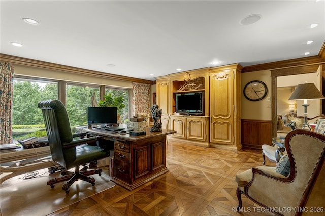 office featuring wood walls, light parquet flooring, and ornamental molding