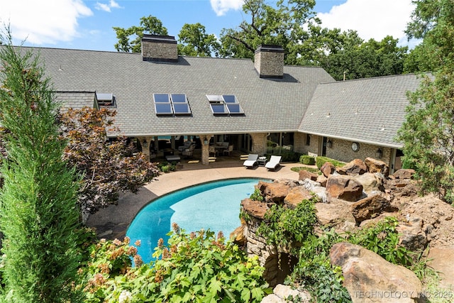 view of pool featuring a patio